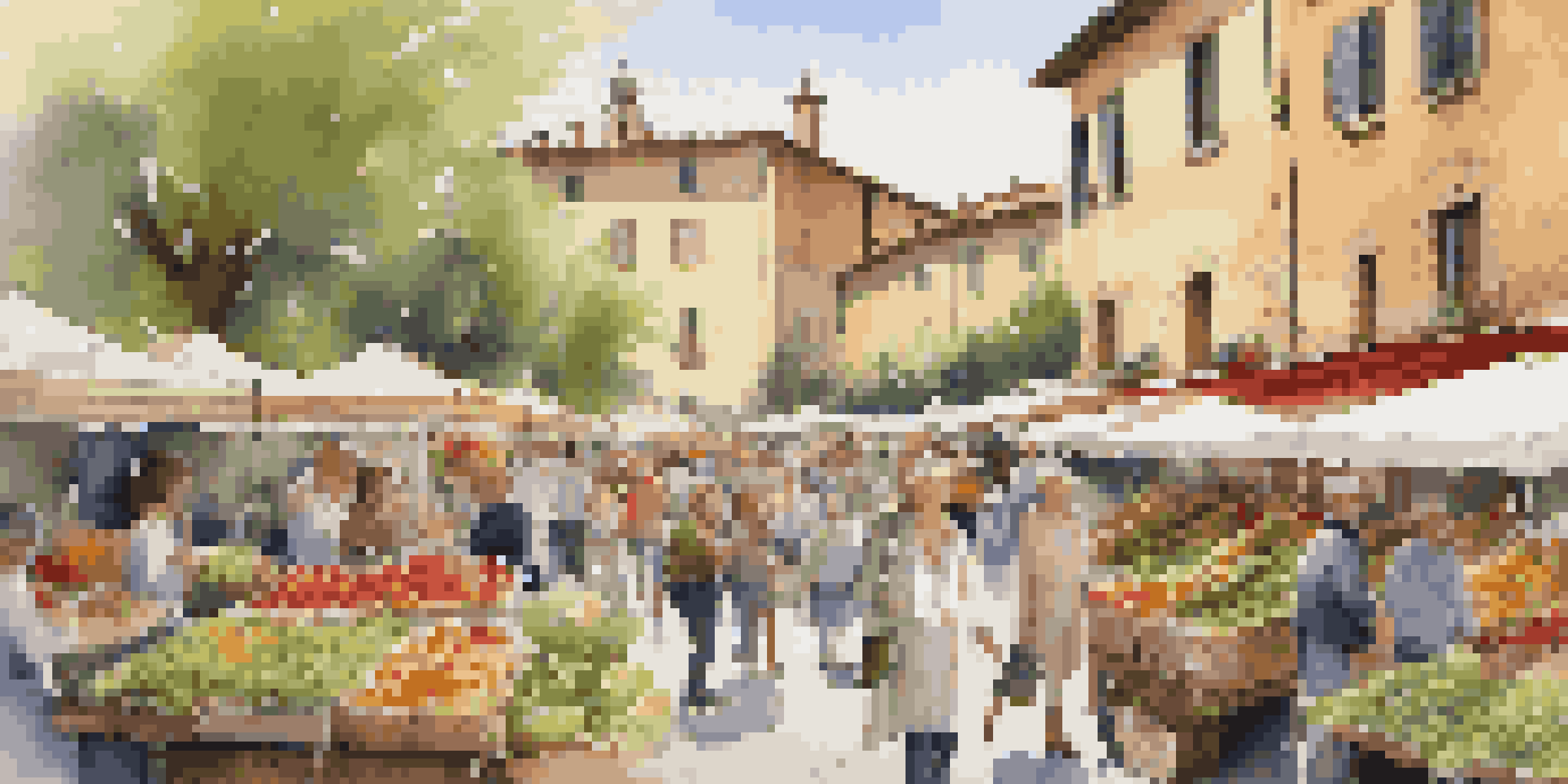 A lively farmers' market in Tuscany featuring fresh asparagus and artichokes surrounded by blooming flowers and people enjoying the day.