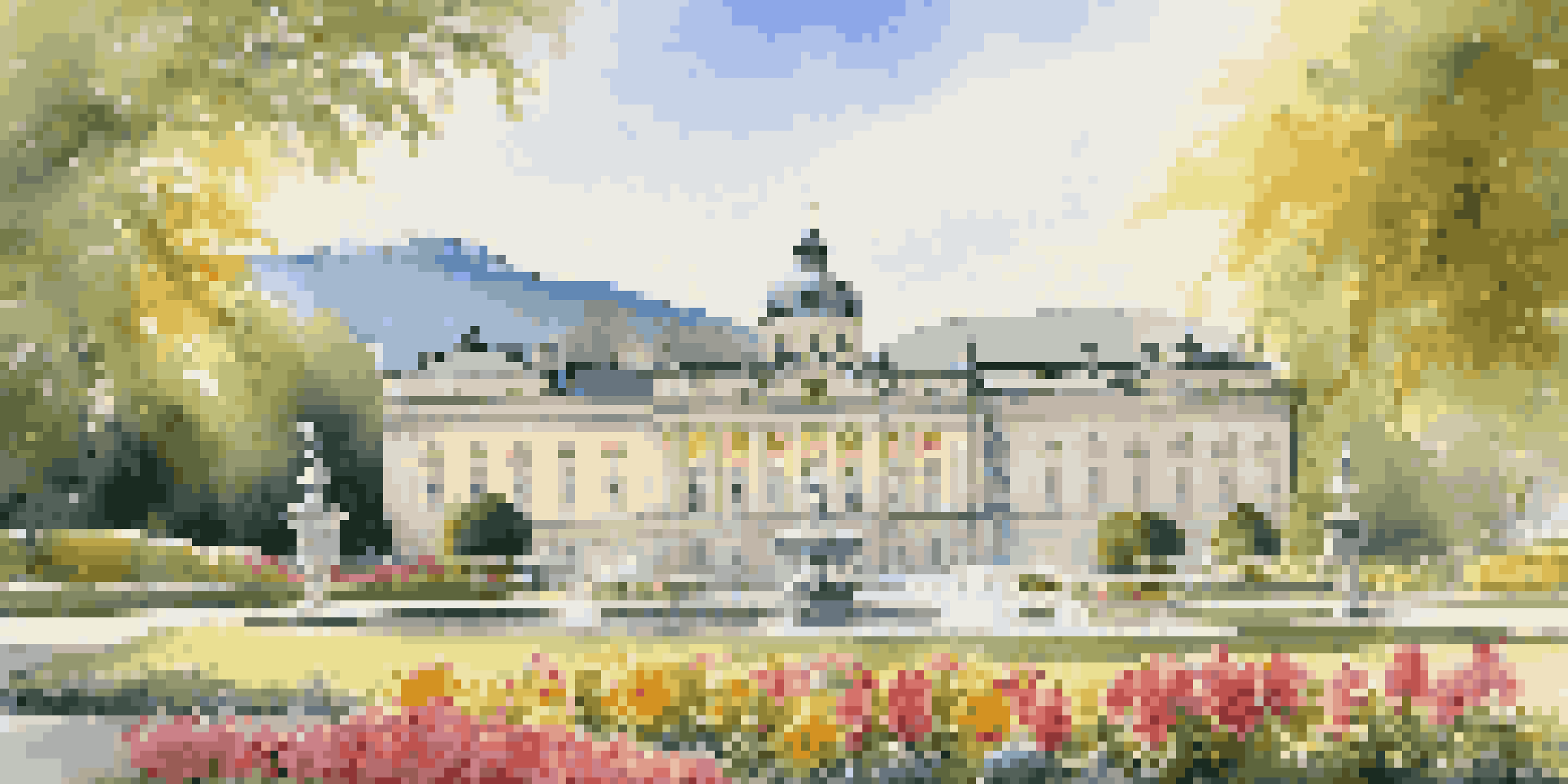 A picturesque view of Mirabell Palace and Gardens, featuring colorful flowers and the Pegasus Fountain, with Hohensalzburg Fortress in the background under soft sunlight.