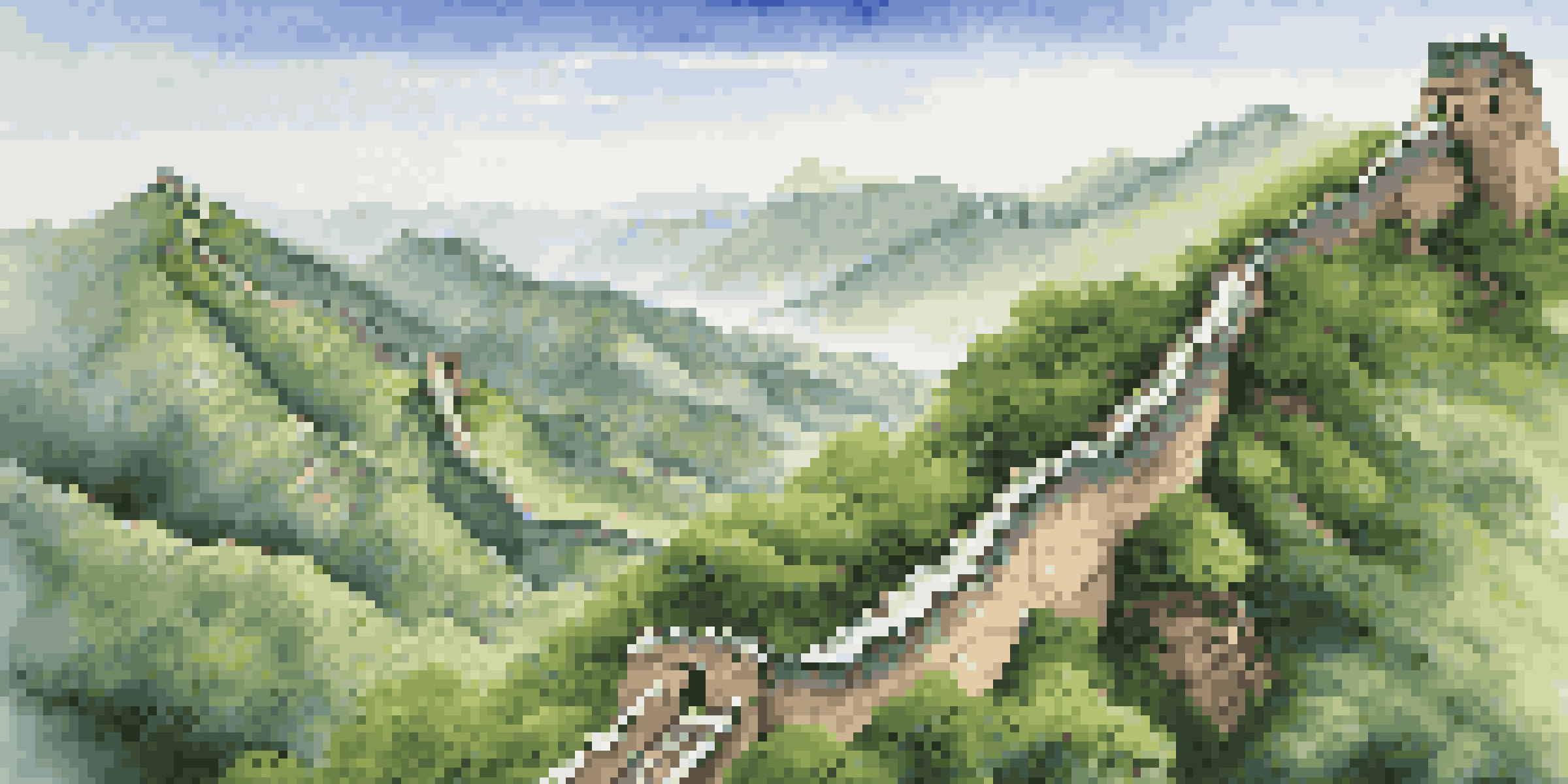 A panoramic view of the Great Wall of China stretching through green mountains under a clear sky.