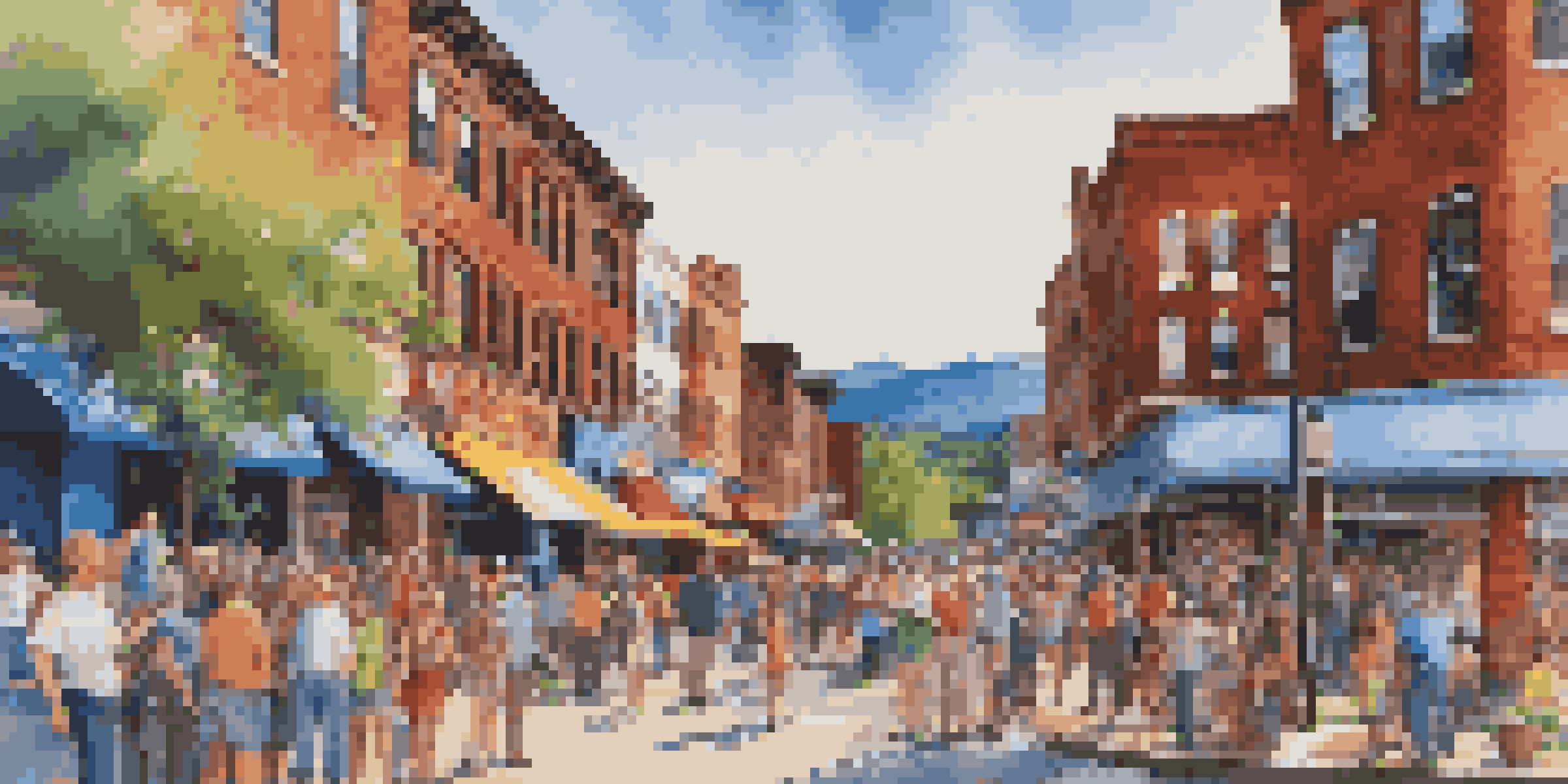 A lively street in Asheville with colorful murals, artists at work, and musicians performing, with the Blue Ridge Mountains in the background.