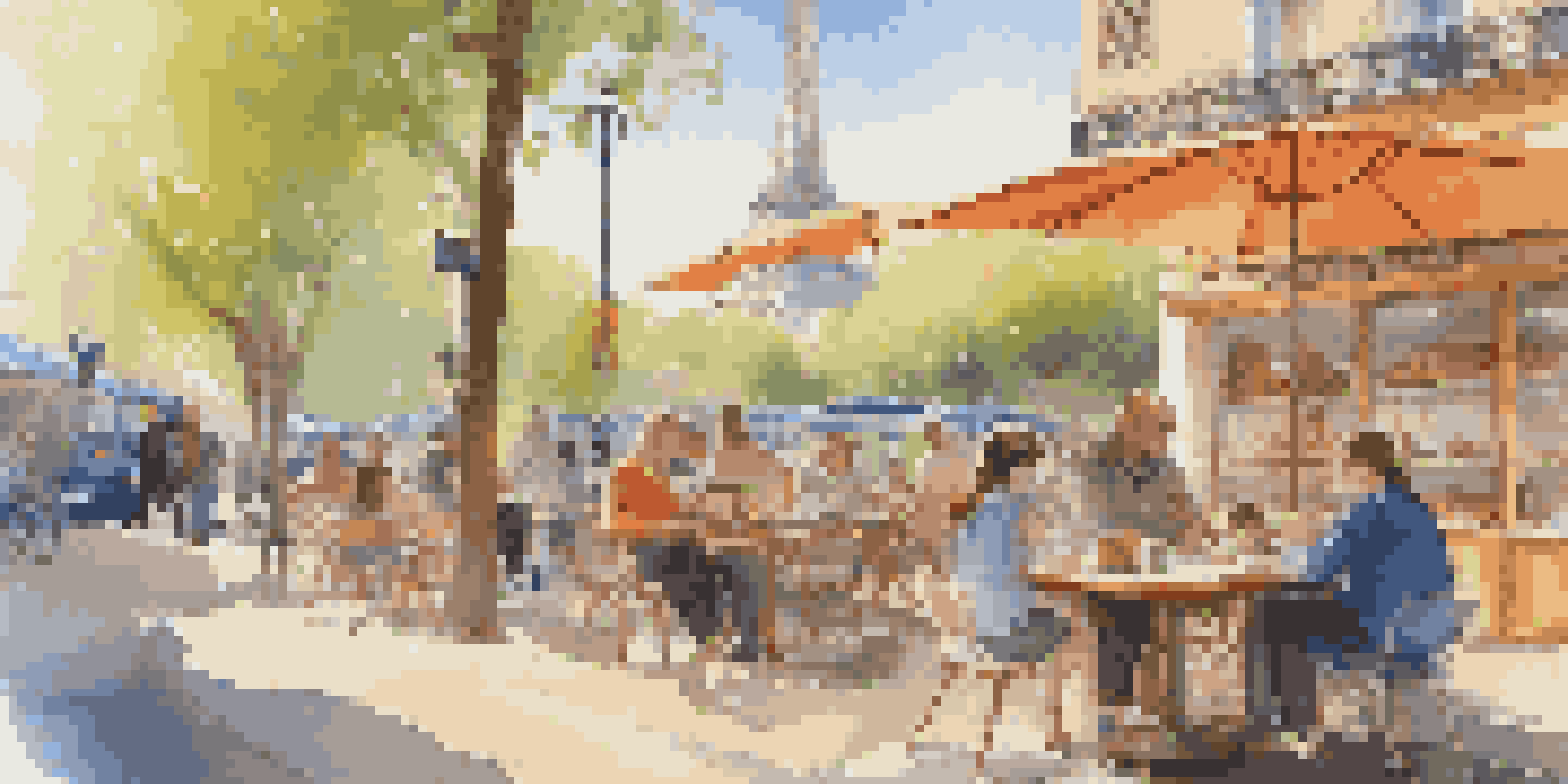 A family in a café in Paris, with a laptop and children playing in a playground outside.