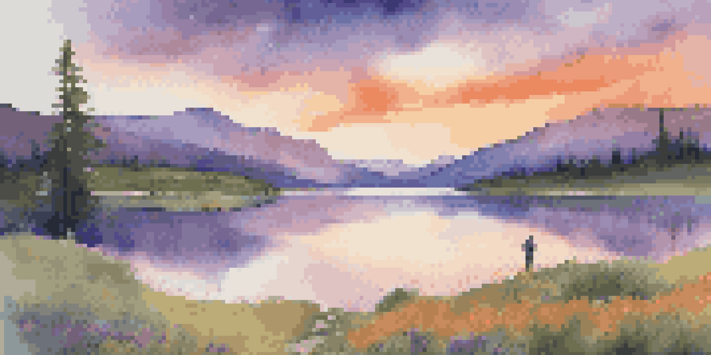 A traveler stands by a calm lake during sunset, with mountains in the background and colorful skies.