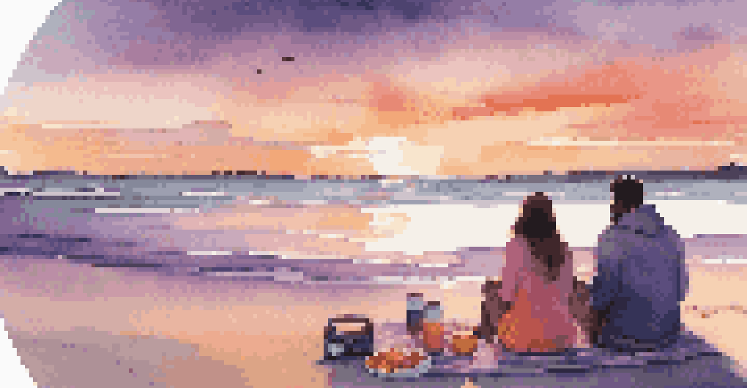 A couple sitting on a blanket at the beach during sunset, surrounded by snacks and a speaker, with a colorful sky overhead.