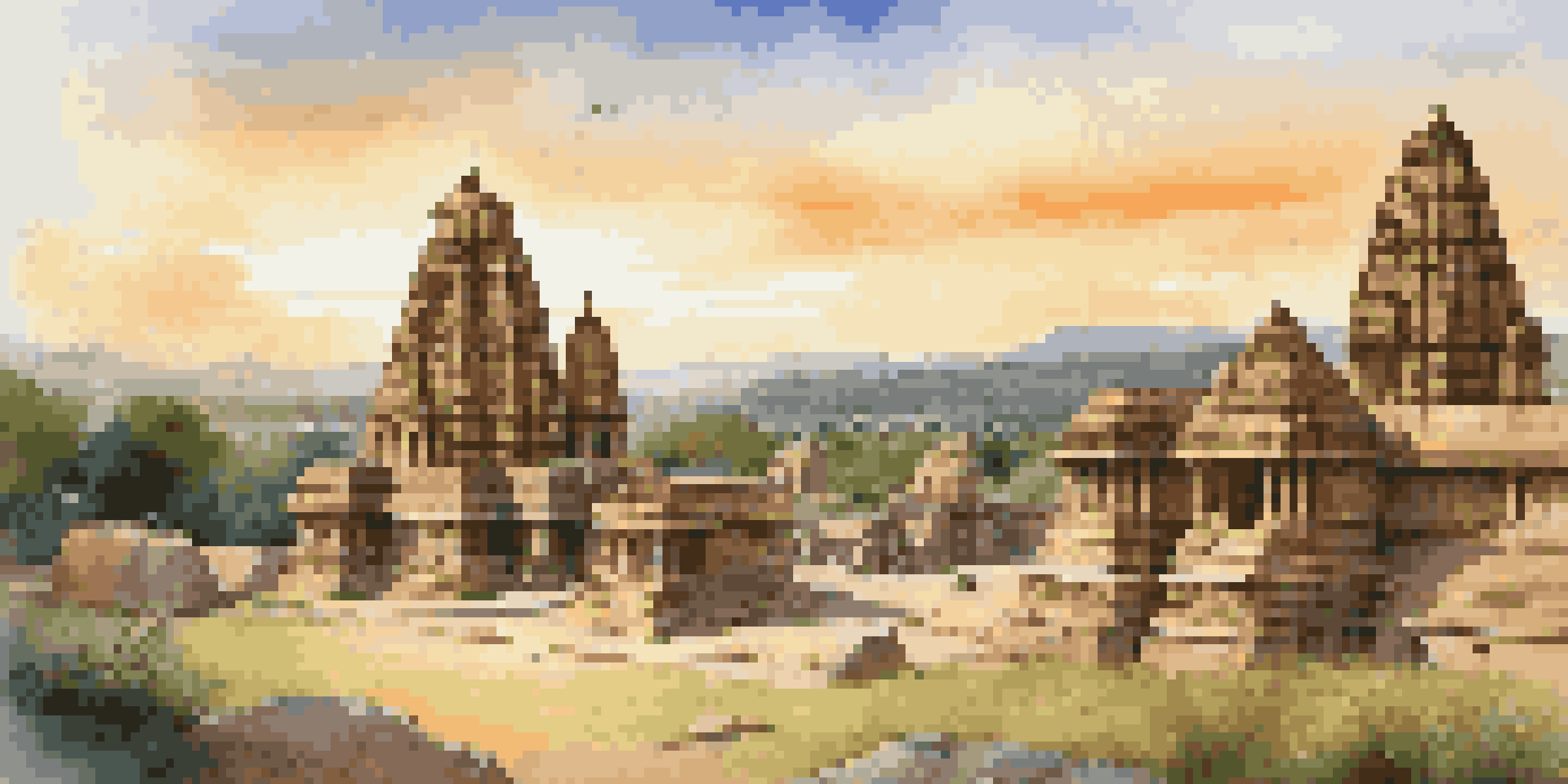 A scenic sunset view of Hampi, highlighting the Virupaksha Temple and surrounding boulders with warm golden light.