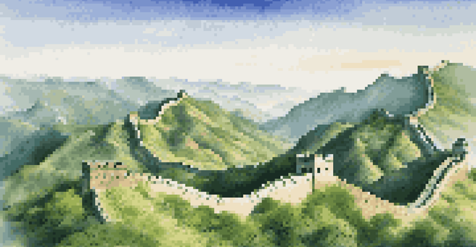 A panoramic view of the Great Wall of China surrounded by green mountains and a blue sky.