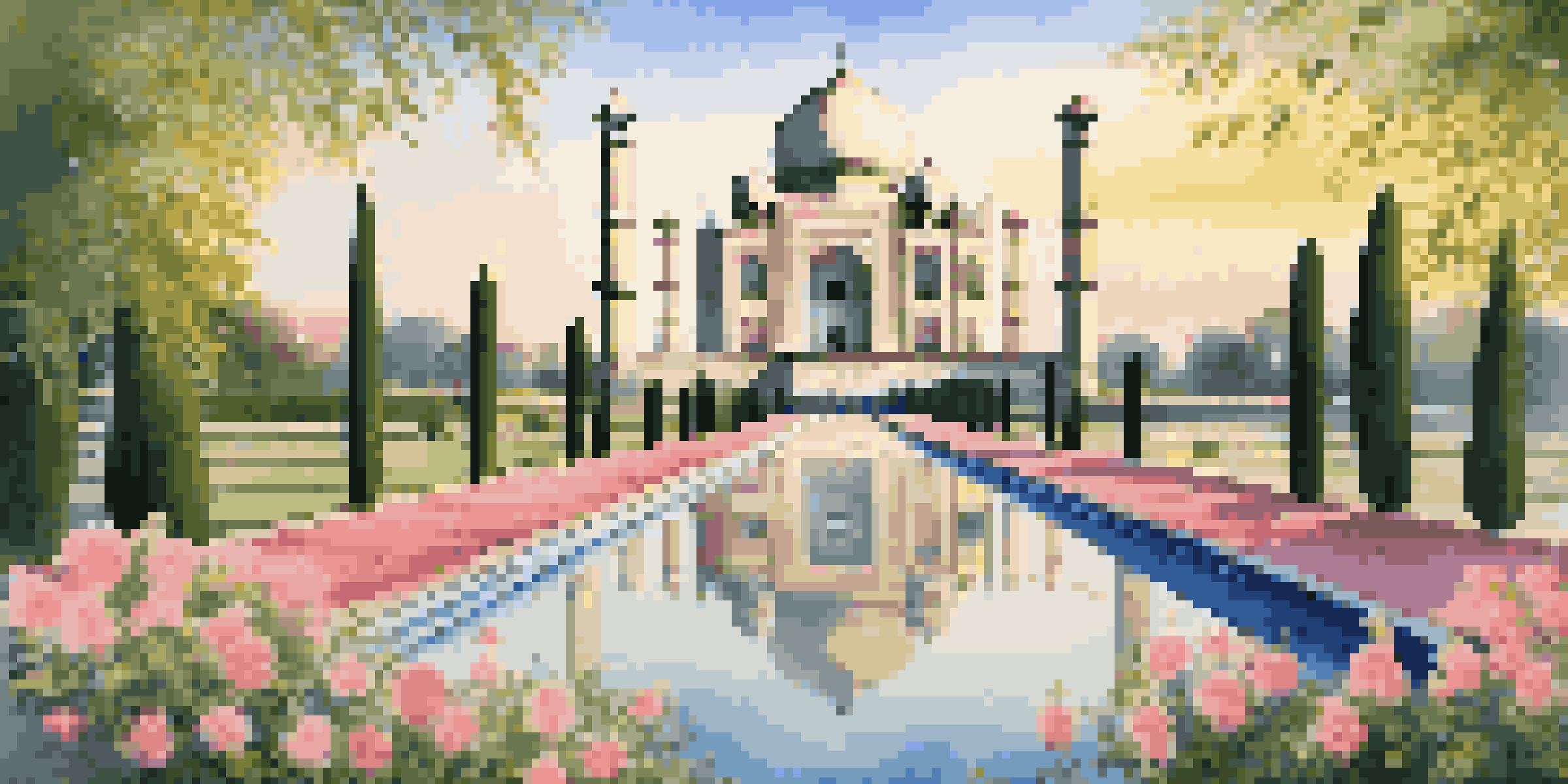 A stunning view of the Taj Mahal illuminated by the sunrise, surrounded by gardens and a reflective pool.