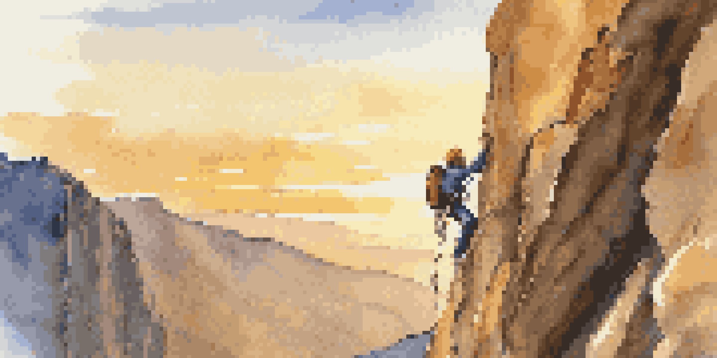 A climber in a harness and helmet ready to climb a rock face during sunset.