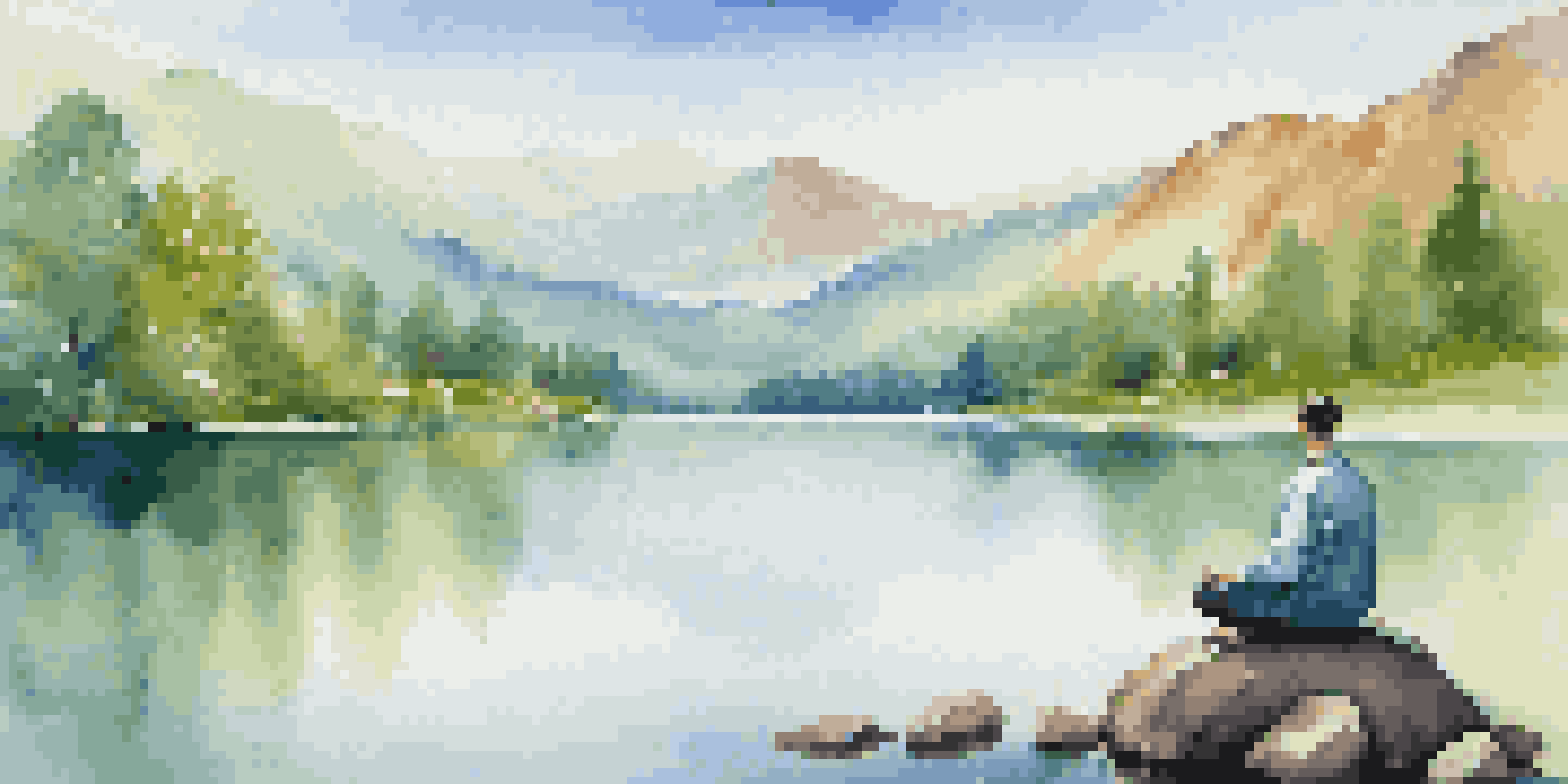 A person meditating by a calm lake, with green forests and mountains in the background, under a clear blue sky.