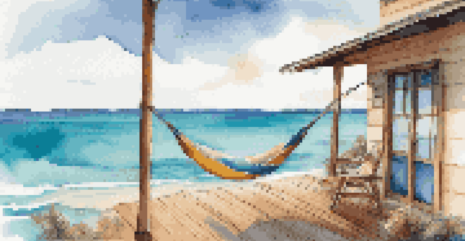 A beachside accommodation featuring a wooden deck with a hammock and a laptop, overlooking a sparkling ocean under a clear blue sky.