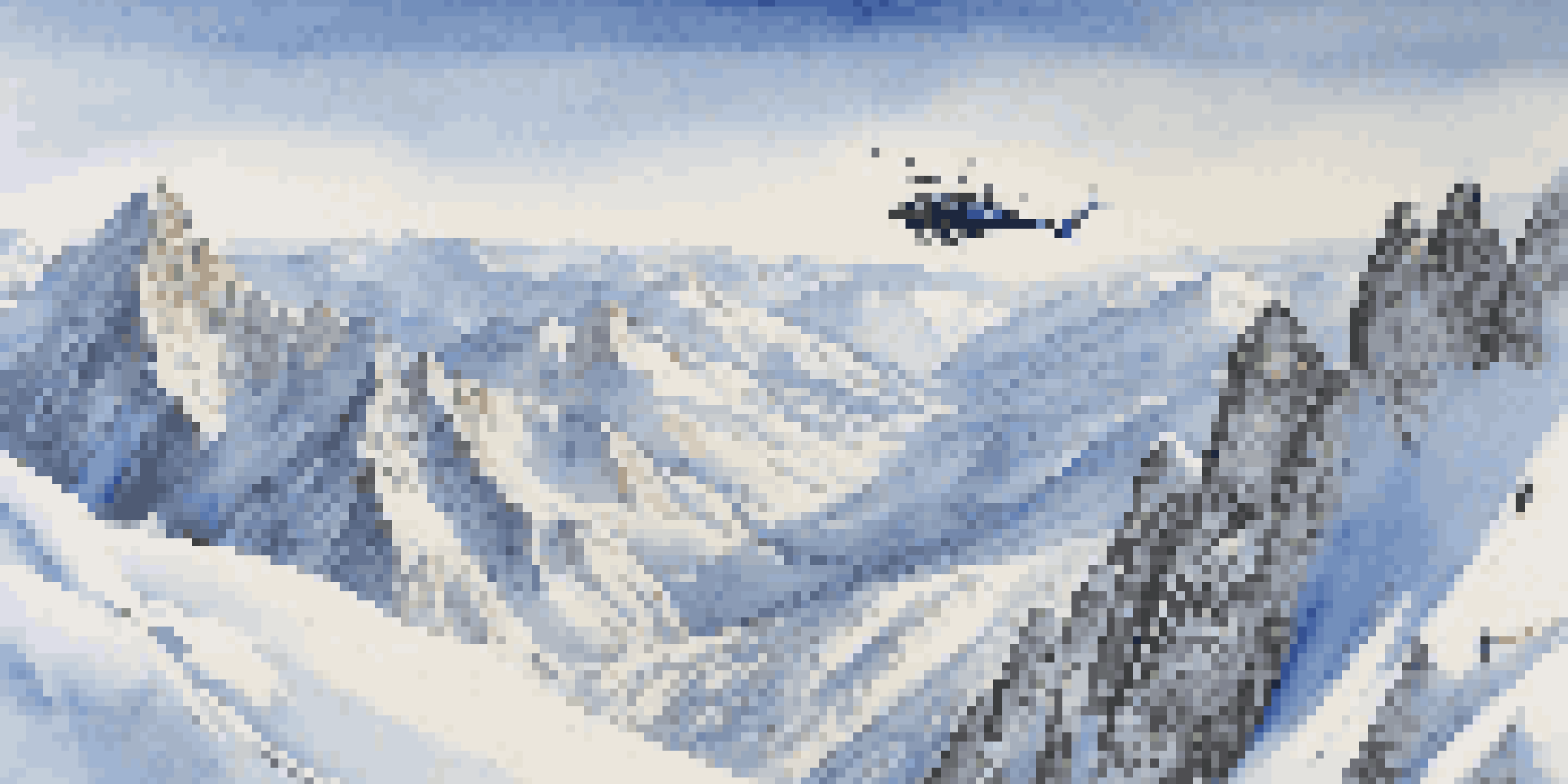 A helicopter above snowy mountains with skiers getting ready to ski down the pristine slopes.