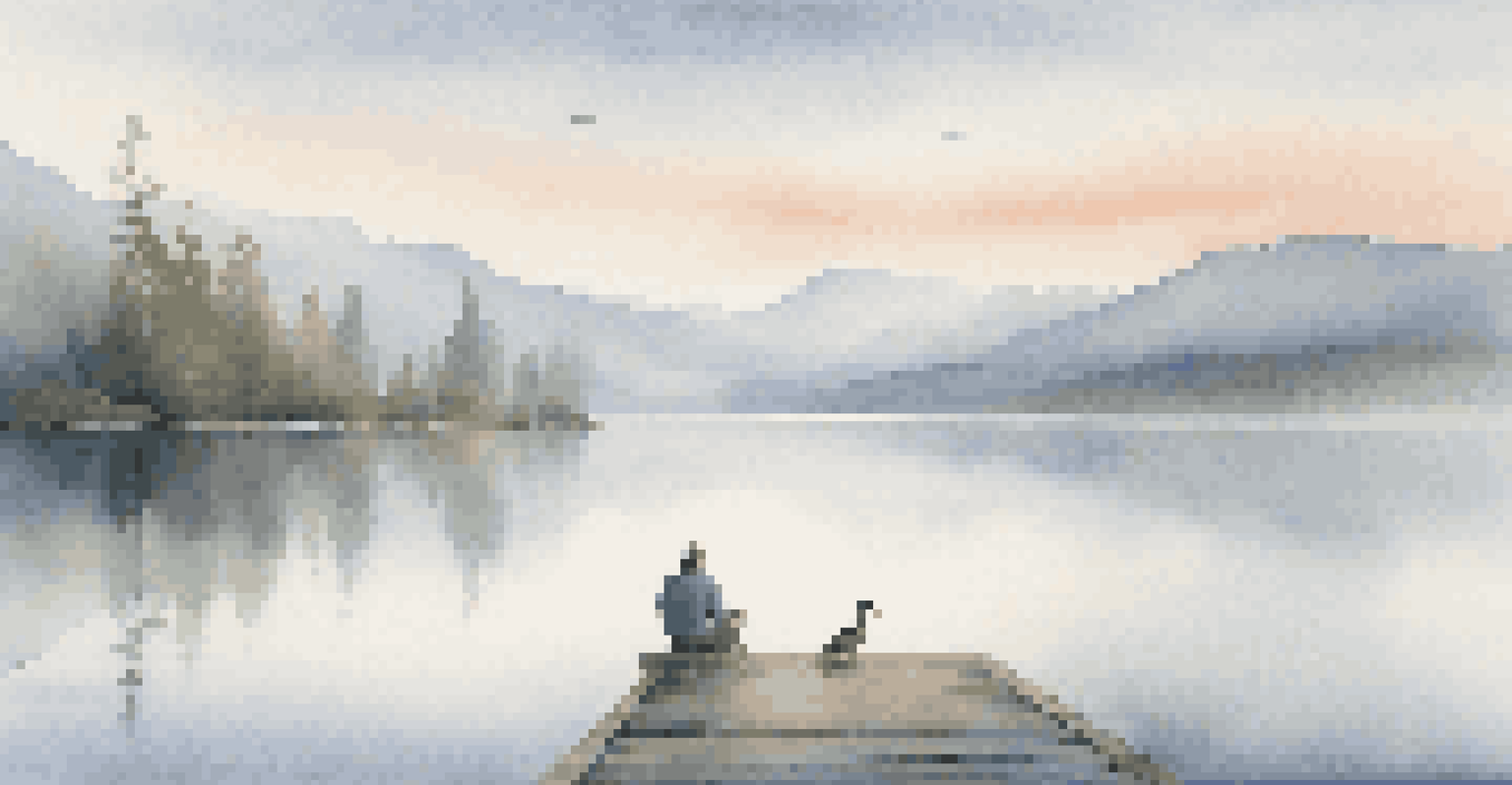 A person sitting on a dock by a tranquil lake, with mountain reflections and morning fog creating a serene atmosphere.