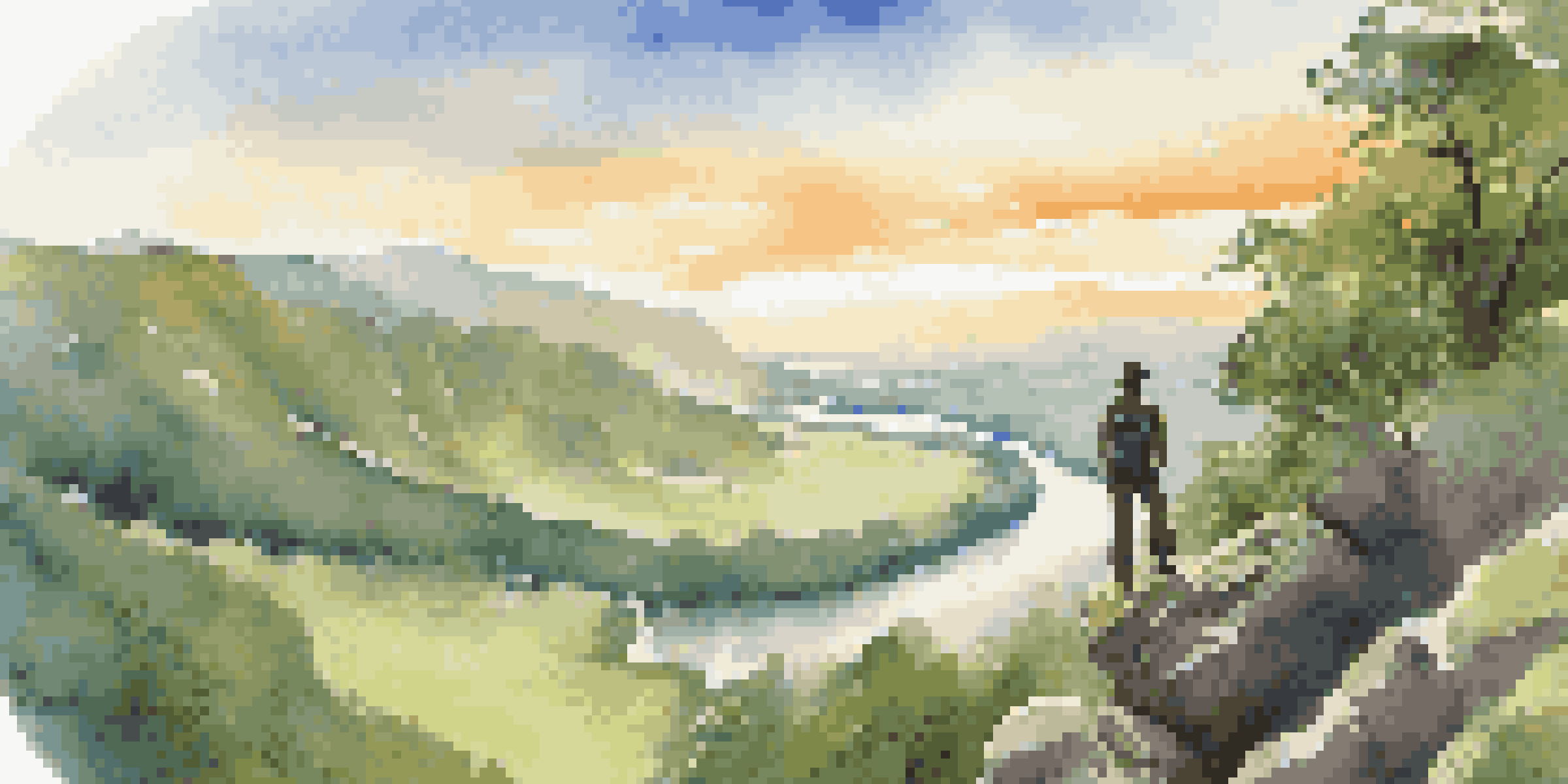 A hiker on a rocky outcrop gazing over a green valley and a winding river during sunset.