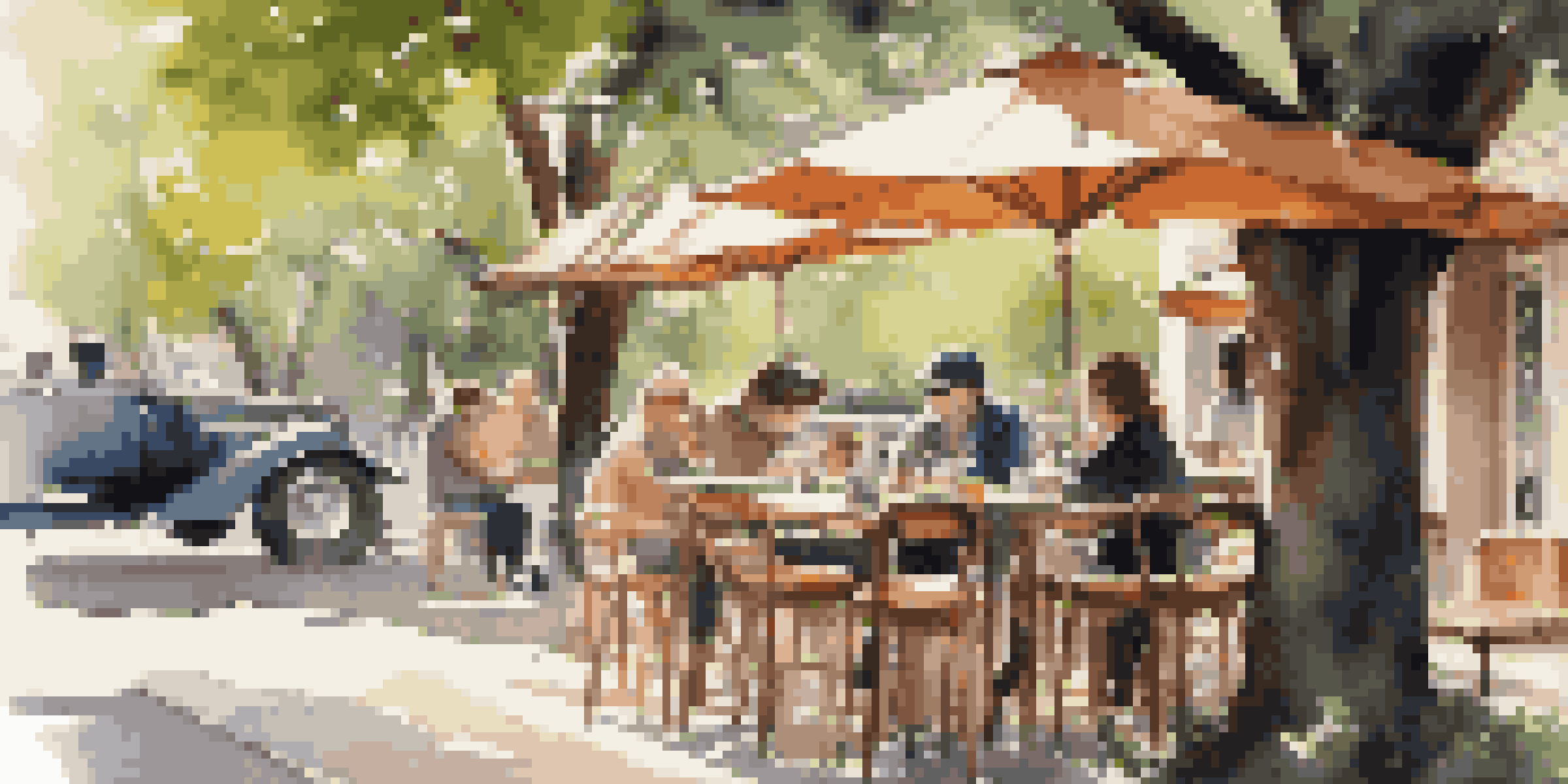 A stylish camera bag on a wooden table at an outdoor café, with soft sunlight filtering through trees and blurred people in the background.
