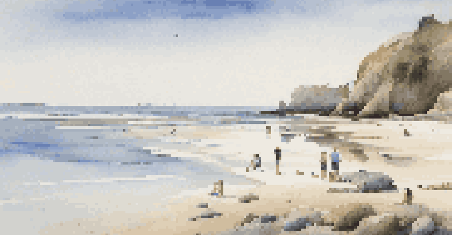 A beach scene showing one person relaxing on the sand while others explore tide pools, under a clear blue sky.