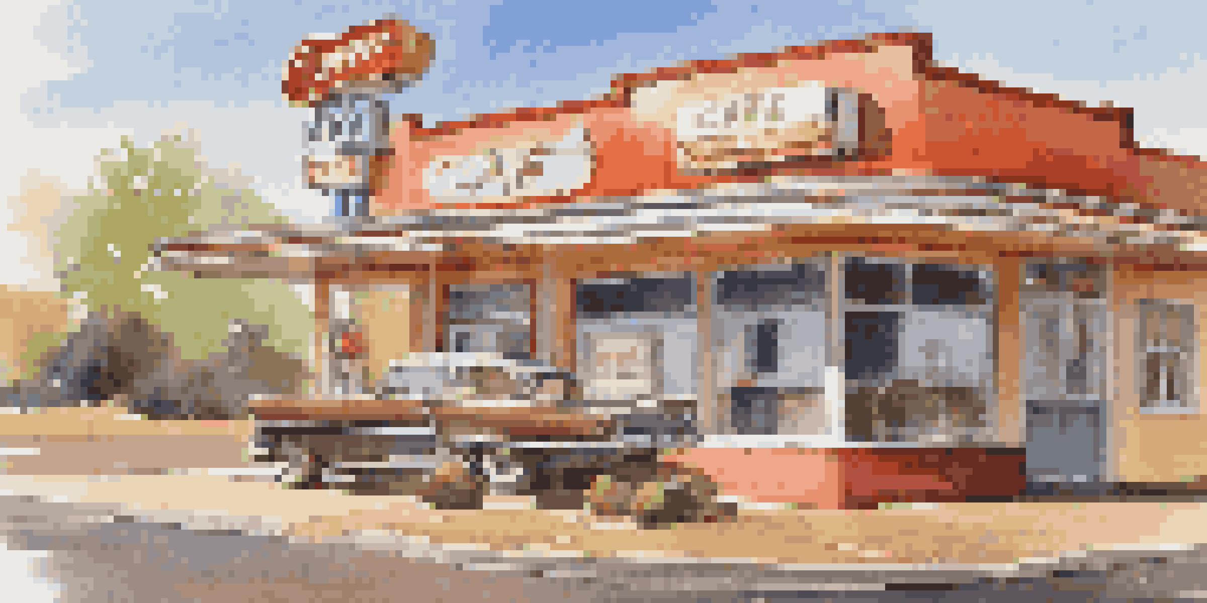 A cozy diner scene at The Roadrunner Cafe with vintage decor, fluffy pancakes, and warm lighting.