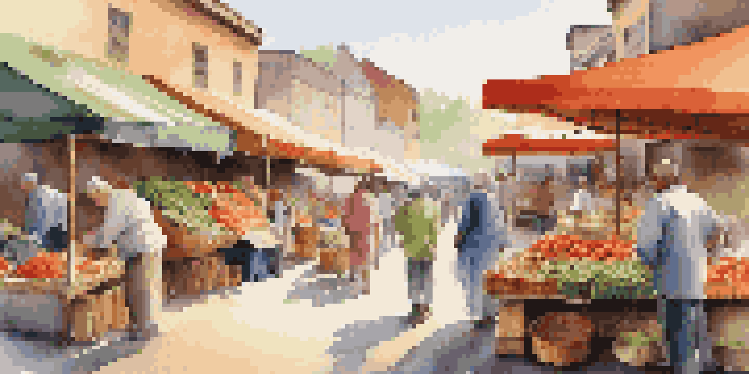 A bustling local market with colorful stalls filled with fruits and vegetables, locals chatting and enjoying street food under warm morning light.
