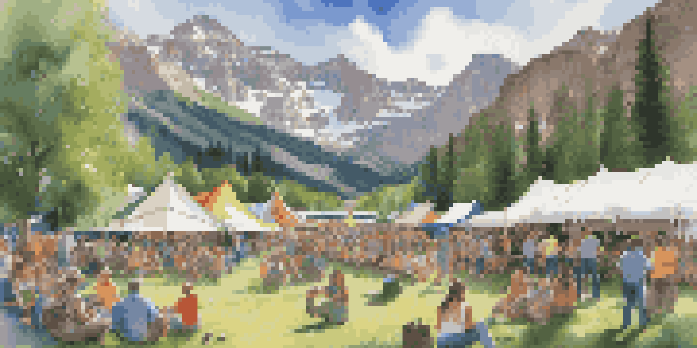 A lively festival scene in a mountain meadow surrounded by Rocky Mountains, with colorful tents and a crowd enjoying live music.