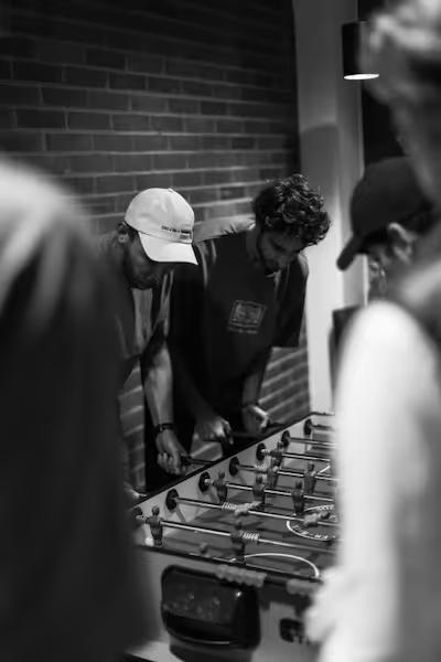 Cortians playing foosball at CortiCon