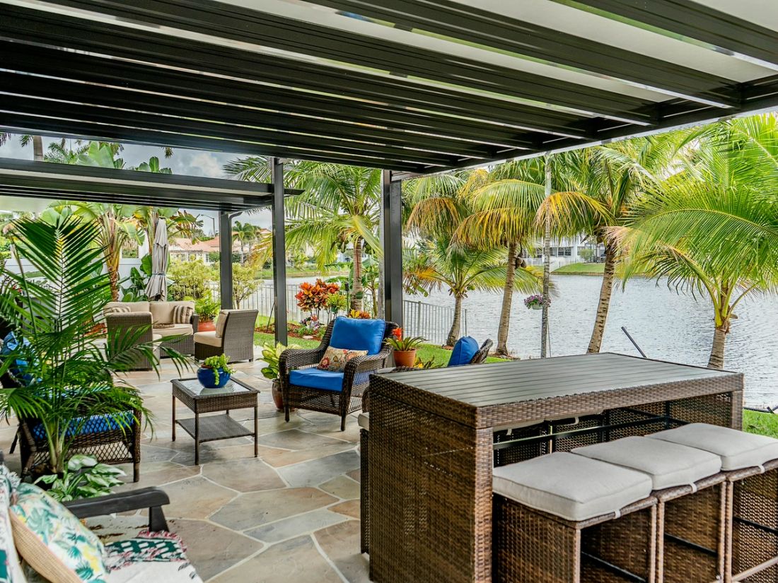 Aluminum pergola in a Boca Raton backyard, Palm Beach County — attached vs. freestanding comparison