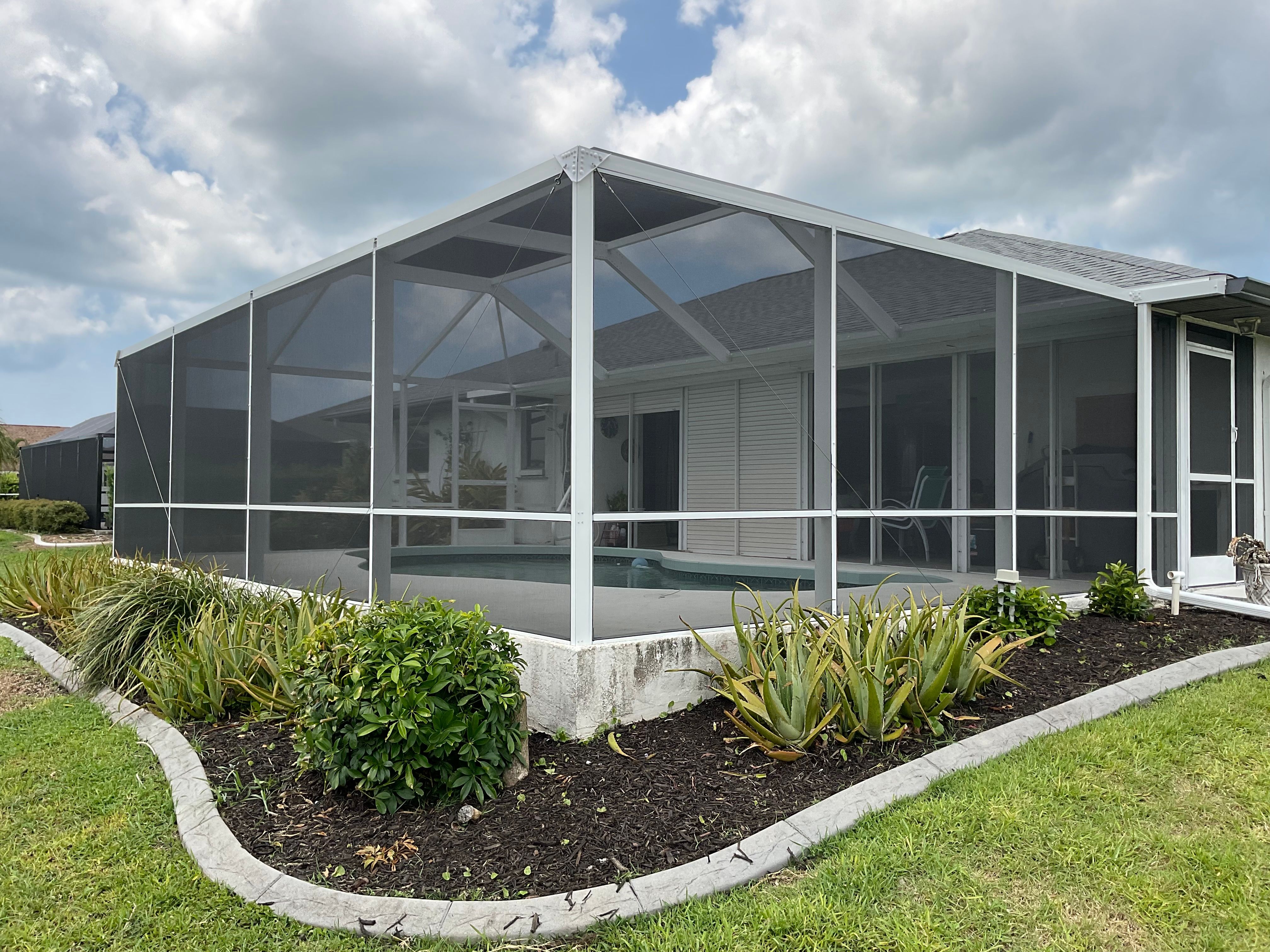 Pool screen cage aluminum structure South Florida residential — AB Aluminum & Screens