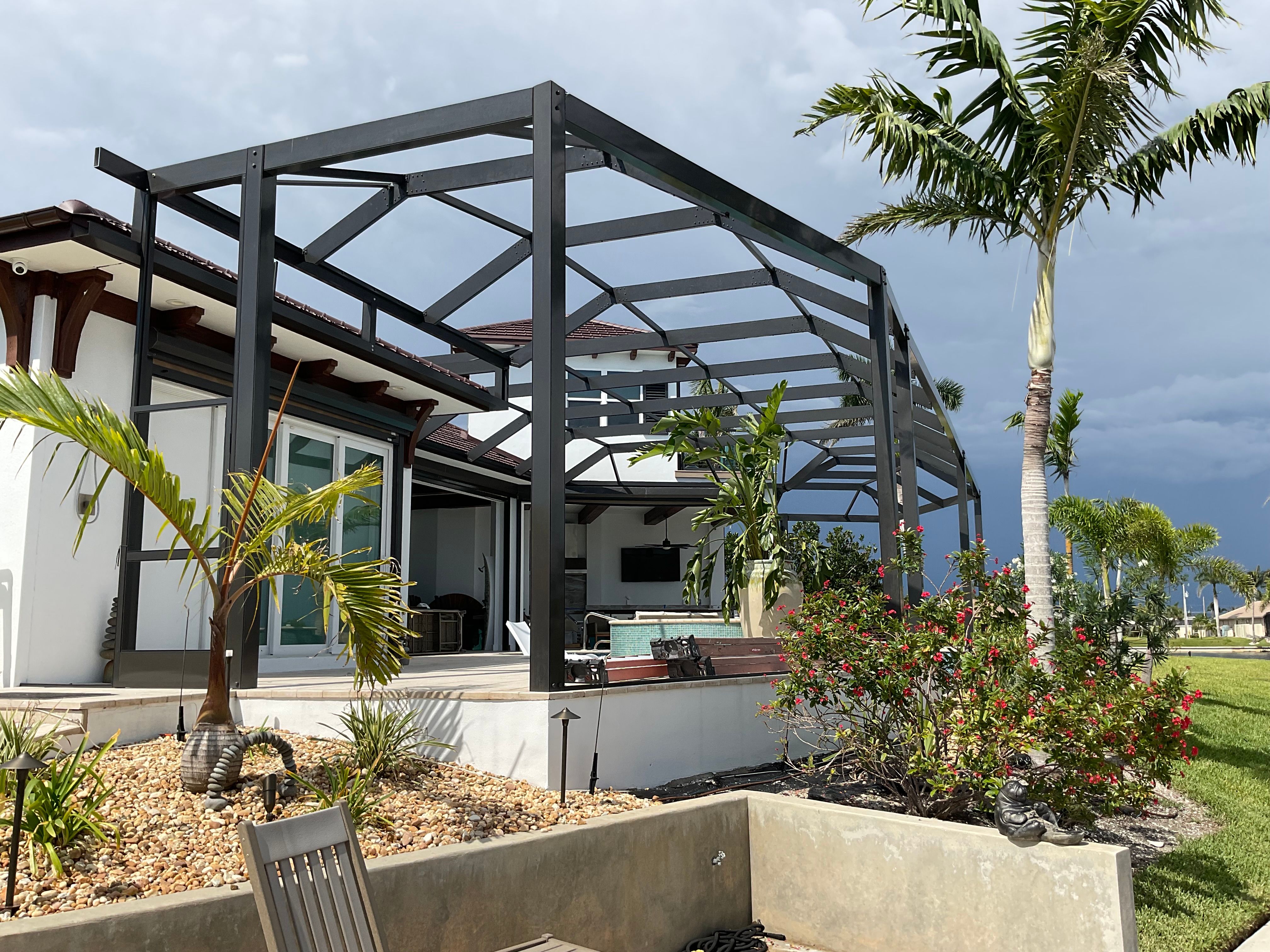 Completed pool cage installation residential home Miami — AB Aluminum & Screens