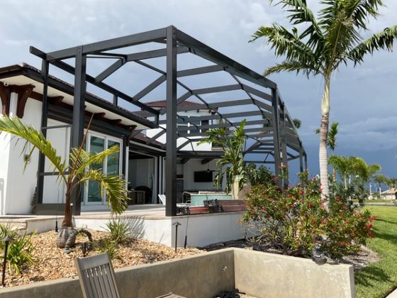 Completed pool cage installation residential home Miami — AB Aluminum & Screens
