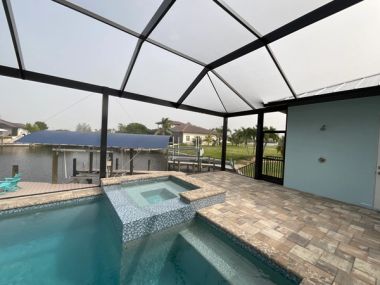 Aluminum pool screen enclosure in Wellington, Palm Beach County — home insurance considerations in Florida
