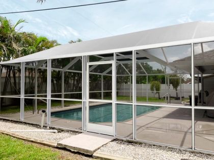 Mansard pool screen enclosure at a Miami-Dade single-family home