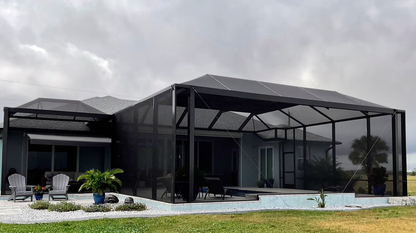 Aluminum pool screen enclosure over a pool at a South Florida home