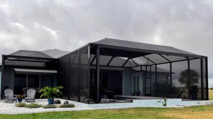 Aluminum pool screen enclosure over a pool at a South Florida home