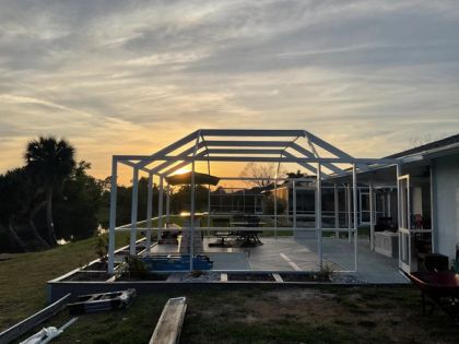 Permitted aluminum pool enclosure meeting Miami-Dade wind load rules in Coral Gables, South Florida