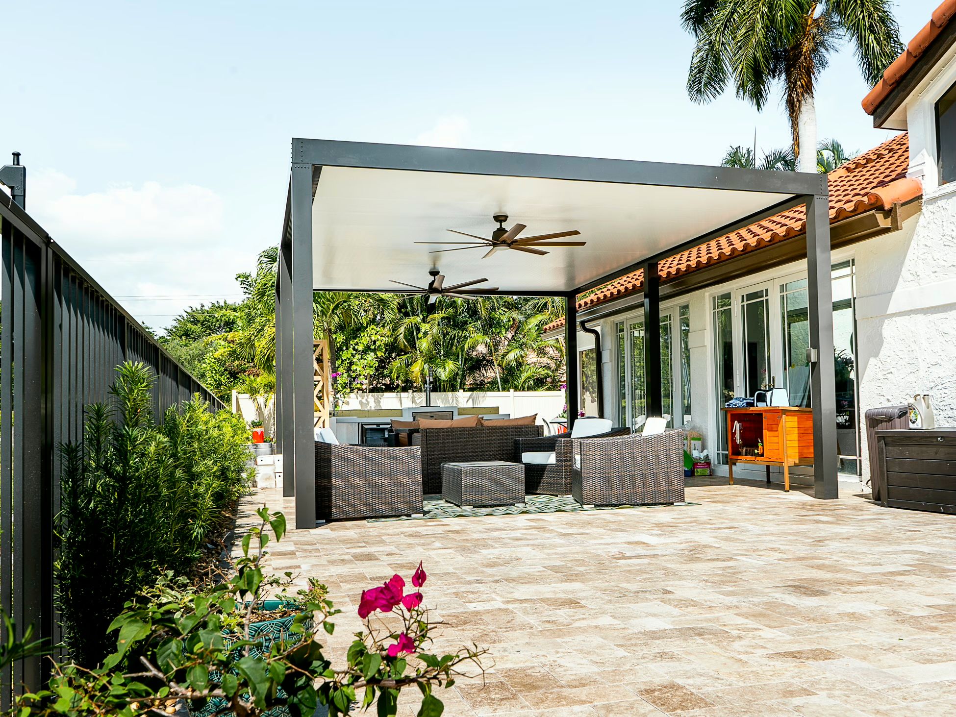 White aluminum pergola with open lattice roof, backyard installation at South Florida home with tropical plants and patio area — AB Aluminum & Screens