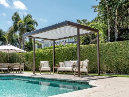 Louvered roof patio with a ceiling fan and outdoor seating in Broward County
