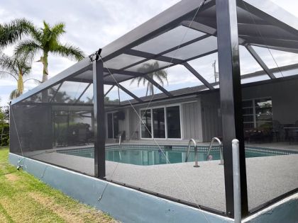Aluminum pool cage over a screened pool in Broward County