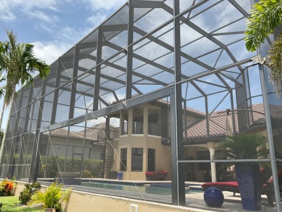 Pool screen enclosure surrounding inground pool South Florida — AB Aluminum & Screens