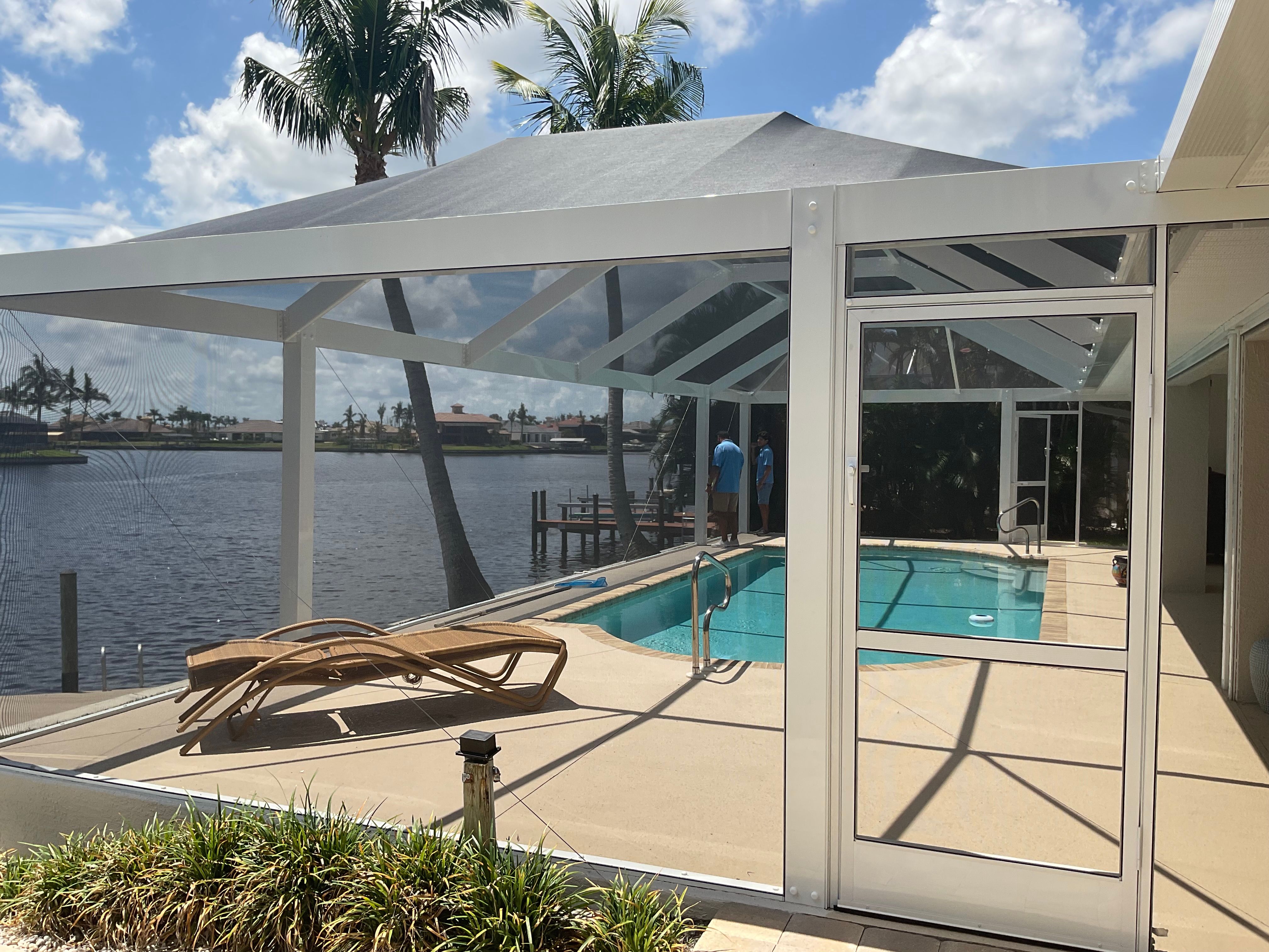 Pool enclosure backyard view Miami residential home — AB Aluminum & Screens
