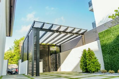 Attached aluminum pergola over a patio at a Miami-Dade home