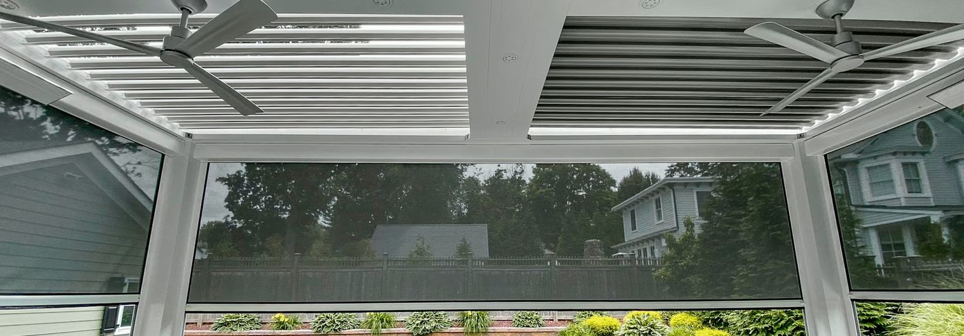 Motorized louvered roof over a backyard patio in South Florida
