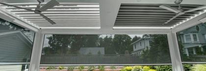 Motorized louvered roof over a backyard patio in South Florida