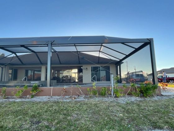 White aluminum pool enclosure frame installation — AB Aluminum & Screens