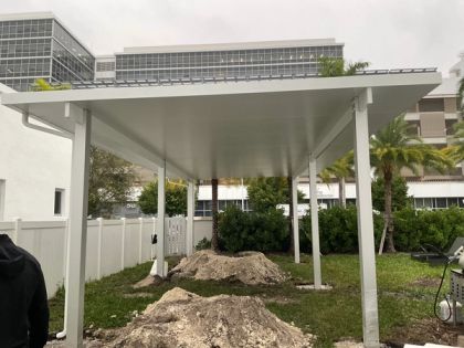 Aluminum pergola over a backyard patio in Southwest Ranches, Broward County — patio cover vs. pergola