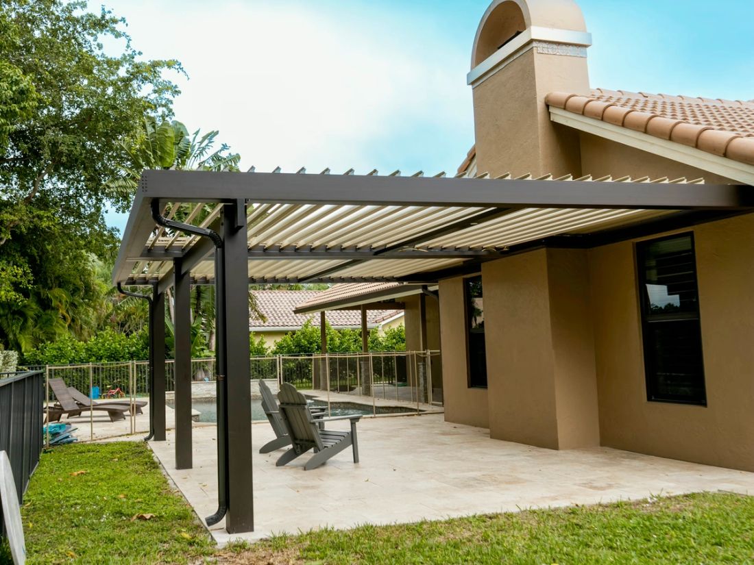 Motorized louvered roof outdoor living space in Southwest Ranches — South Florida outdoor trends for 2026