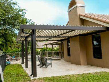Motorized louvered roof outdoor living space in Southwest Ranches — South Florida outdoor trends for 2026