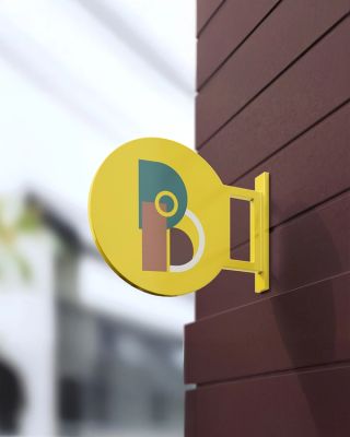 Geel bord met het logo van Atelier Buyck