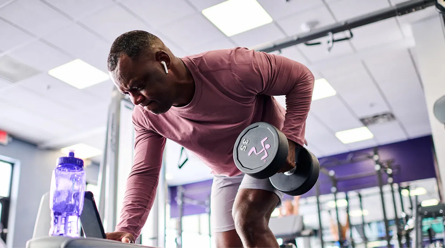 man lifting a dumbbell