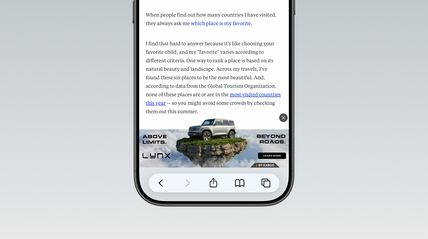 A smartphone displays a webpage with a Lynx SUV banner ad featuring a vehicle on a floating rocky island.