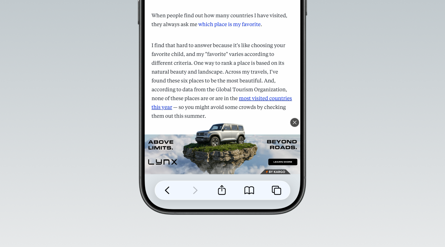 A smartphone displays a webpage with a Lynx SUV banner ad featuring a vehicle on a floating rocky island.