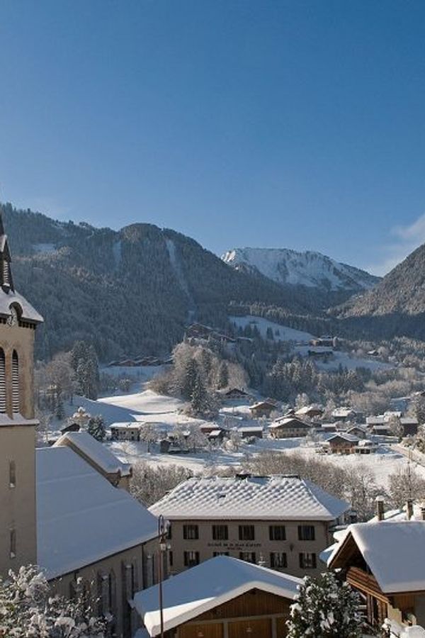 St Jean d'Aulps church spire and village in winter