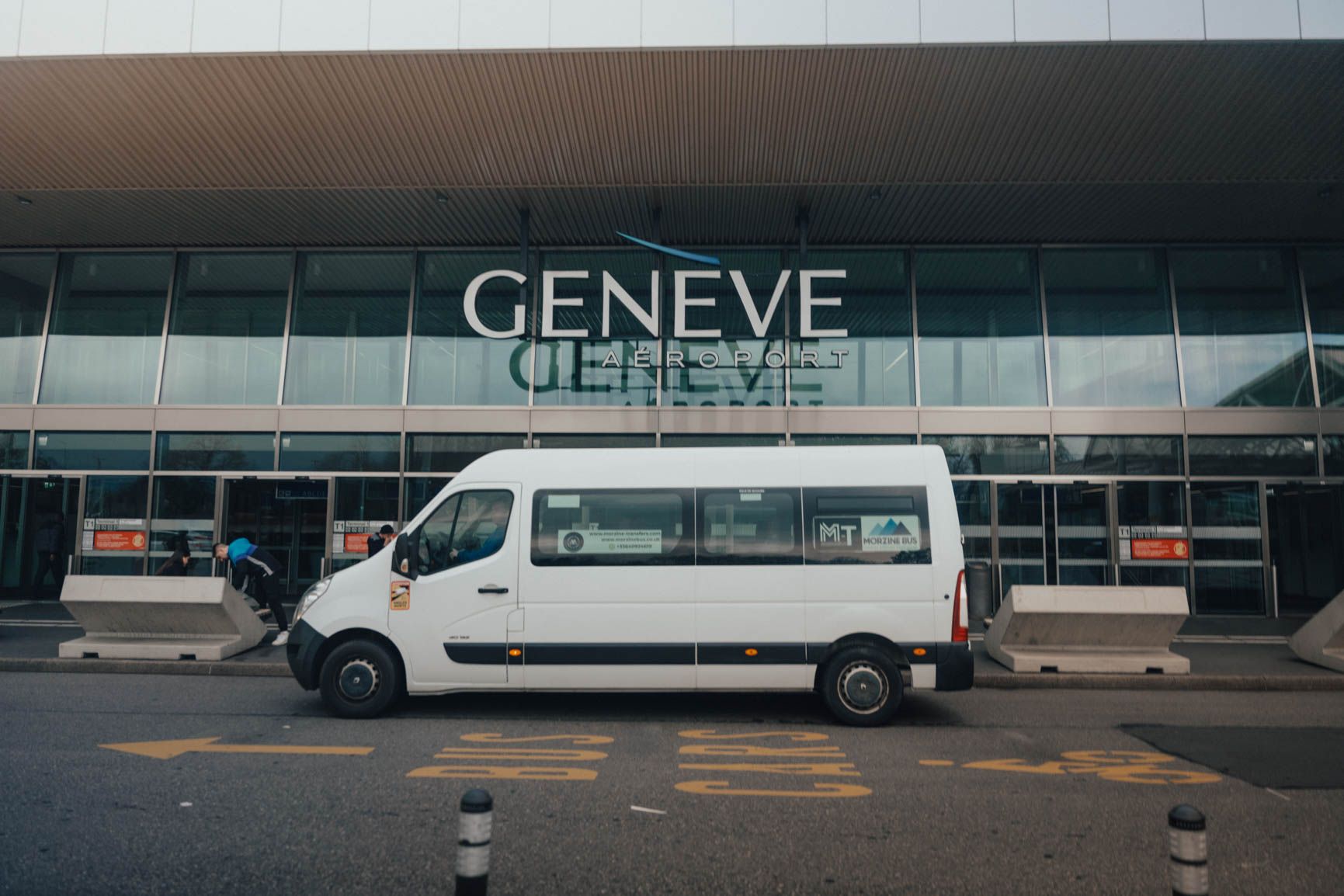 Morzine Bus minibus outside the Geneva Airport terminal
