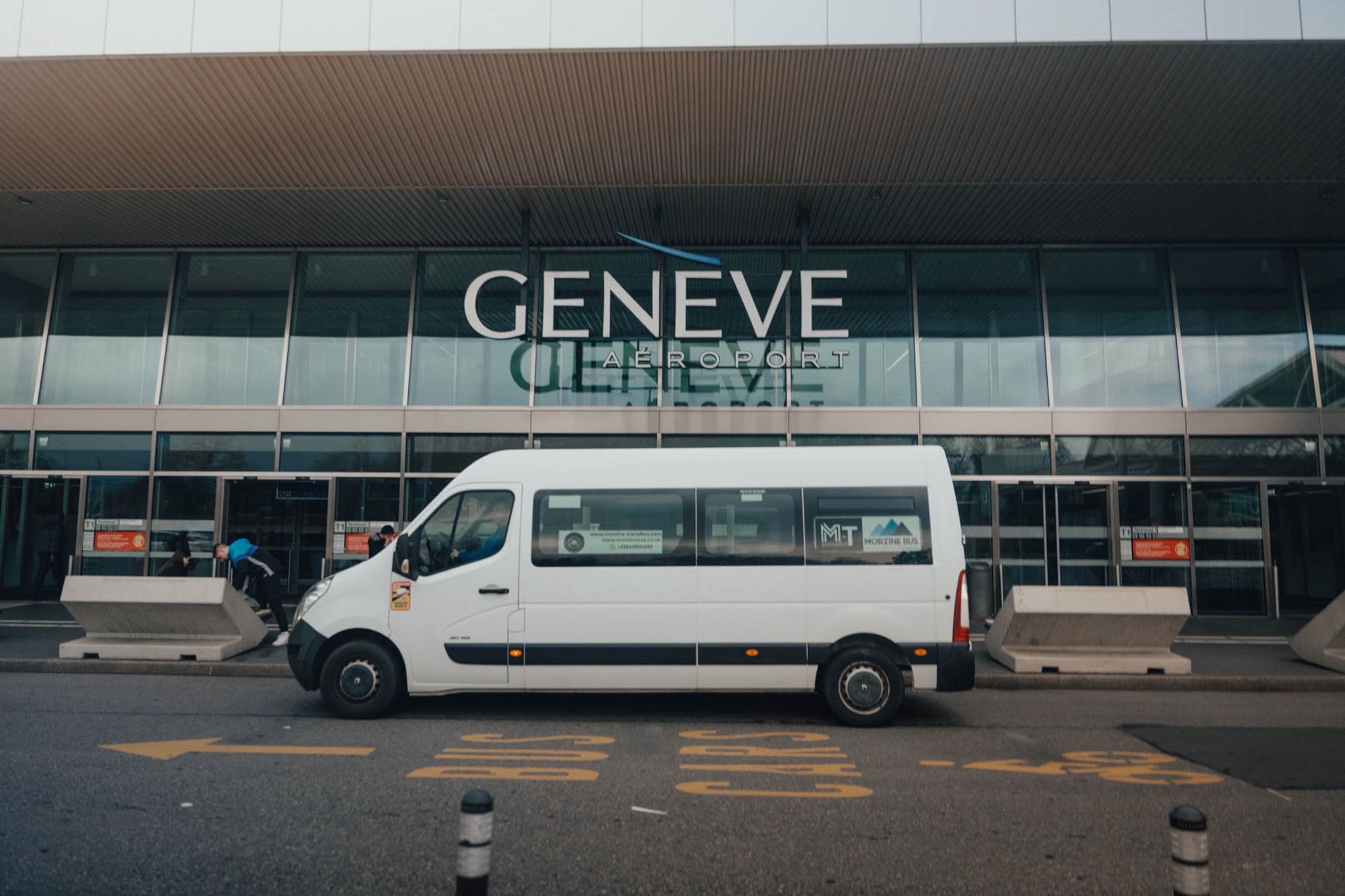 Morzine Bus minibus outside the Geneva Airport terminal